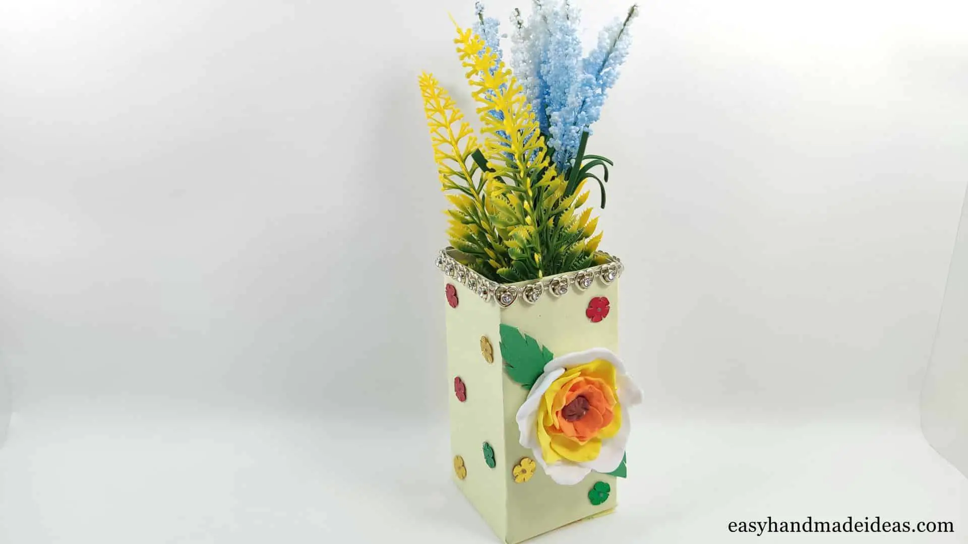 A cardboard flower vase