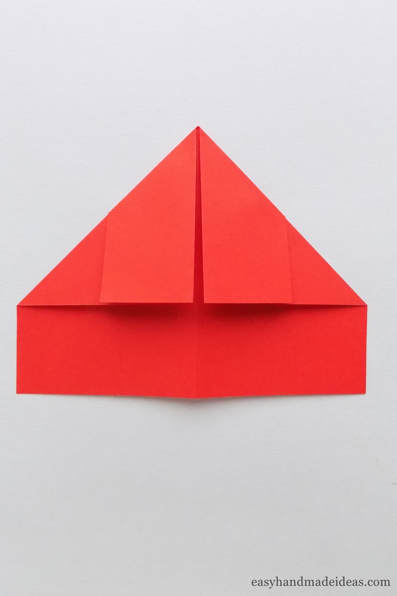Make a triangle from the top corners of the square